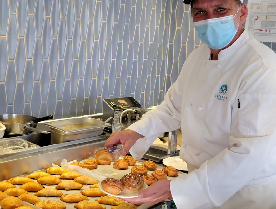 Crystal Serenity Staff serving Cinnamon Rolls on Bahamas Cruise