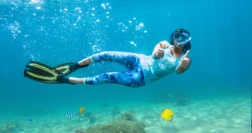 woman snorkeling in antigua