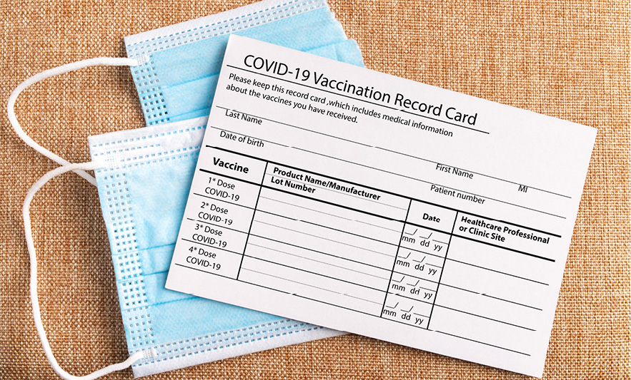 Covid Vaccination card and face masks
